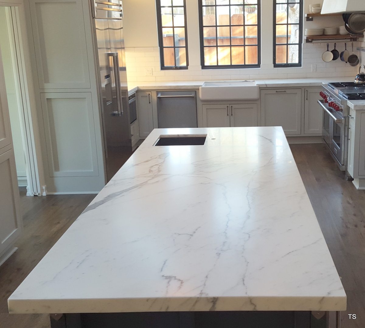 Residential kitchen in Pacific Grove, California with carrara marble protected with TuffSkin satin