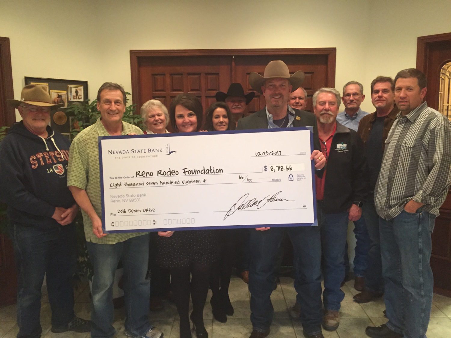 Nevada State Bank's Debby Herman presents check to Reno Rodeo Foundation
