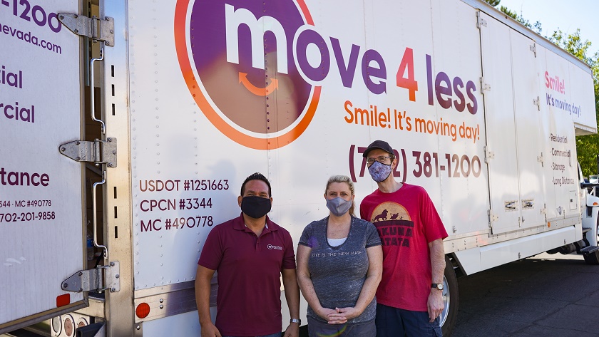 Eyrick Gibson of Move 4 Less (left) with Moving Our Community recipients Michelle and Brian Mell  sm-9f759b79